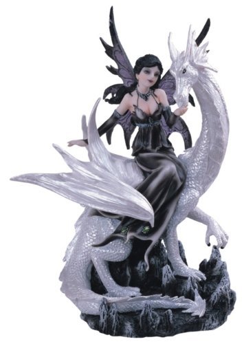 black and white fairy and dragon figurine